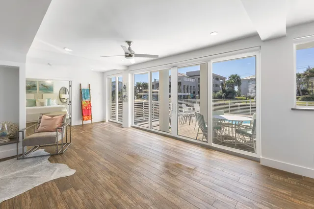 a kitchen with stainless steel appliances kitchen island granite countertop a refrigerator and a stove