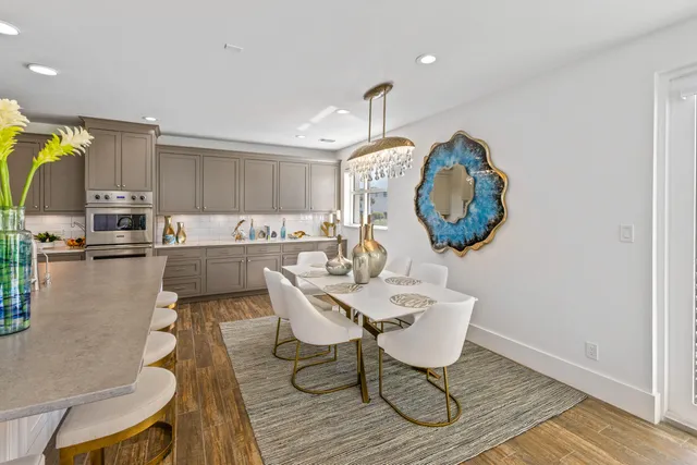 a view of a balcony with floor to ceiling windows with wooden floor
