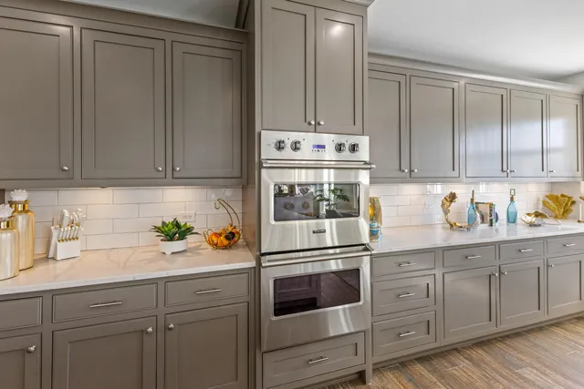 an aerial view of multiple houses with a yard