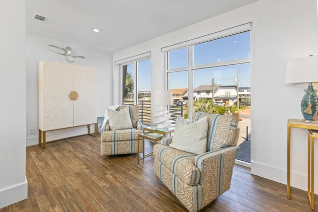 aerial view of a house with a yard porch and sitting area