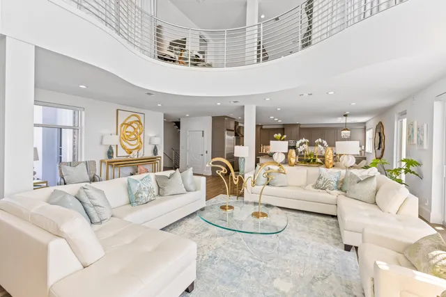 an aerial view of a house with a garden and lake view