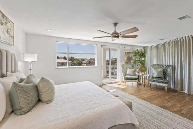 an aerial view of a house with a yard basket ball court and outdoor seating
