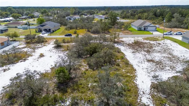 an aerial view of a house with a swimming pool