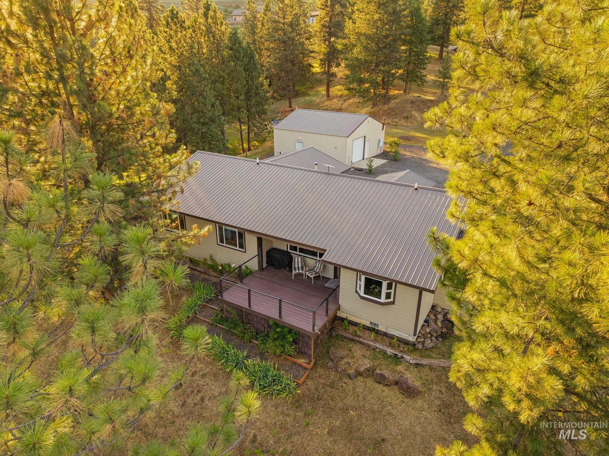 435 River Pointe Lane Lenore, ID 83541 - Photo 43 of 50 Single-story residence featuring a metal roof and a spacious deck