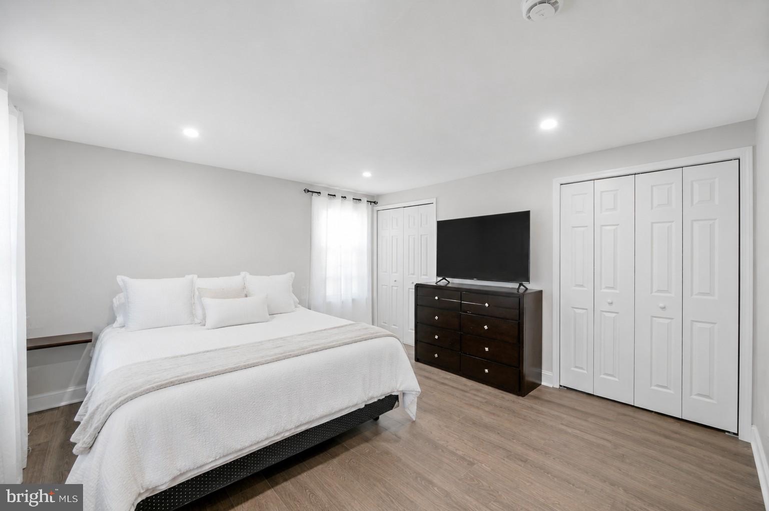 8812 Churchfield Lane Laurel, MD 20708 - Photo 19 of 31 a bedroom with a bed and a flat screen tv