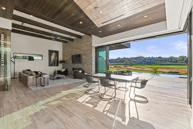 a kitchen with stainless steel appliances a sink a stove and a refrigerator
