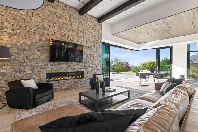 a view of a dining room with furniture and a potted plant