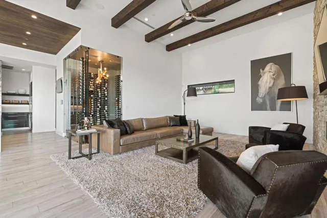a view of a hallway with wooden floor and a potted plant