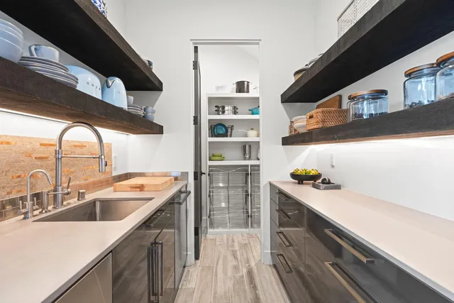 a bedroom with a large bed and a large window