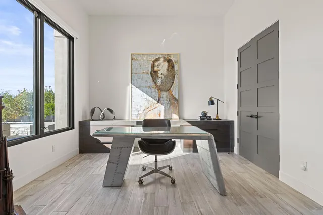 a bathroom with a sink a vanity and a shower
