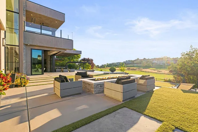a kitchen with stainless steel appliances granite countertop a sink and a refrigerator