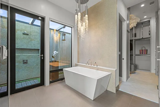 a view of a swimming pool with a lounge chairs