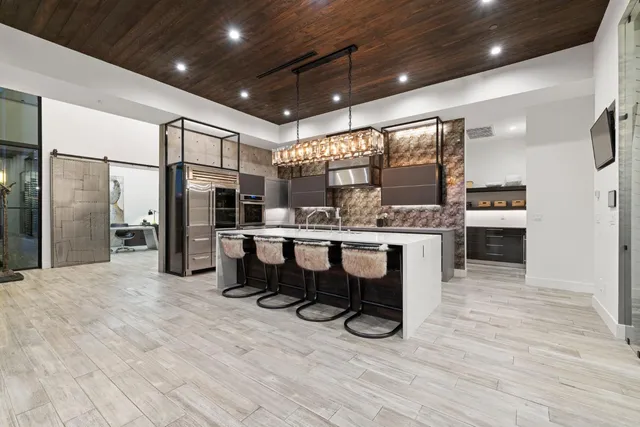a view of a work space with furniture and wooden floor
