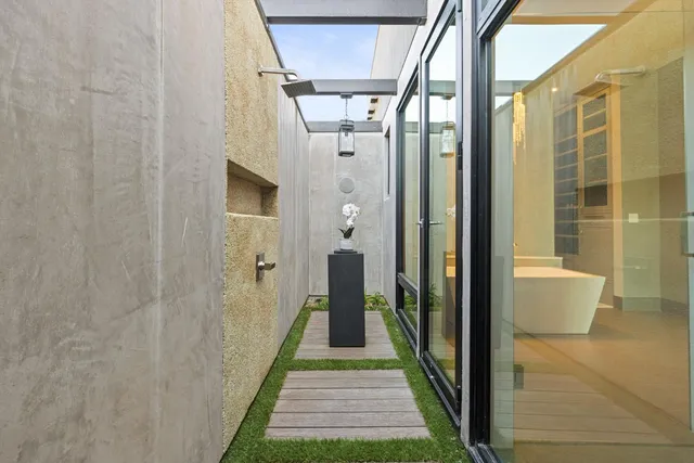 an aerial view of residential houses with outdoor space