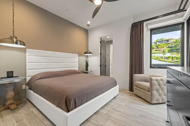 a view of swimming pool with outdoor seating and plants