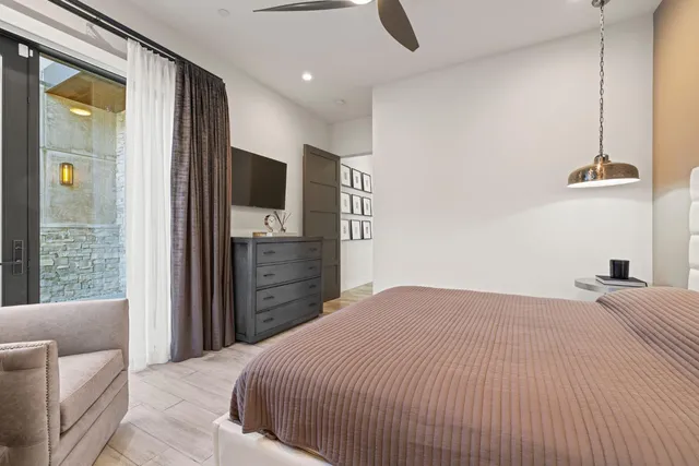 a kitchen with granite countertop a table and chairs in it