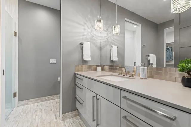 an aerial view of a house with a yard lake and houses view