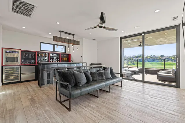 an aerial view of a house with a lake view