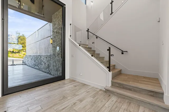 a view of a chairs and table in a balcony