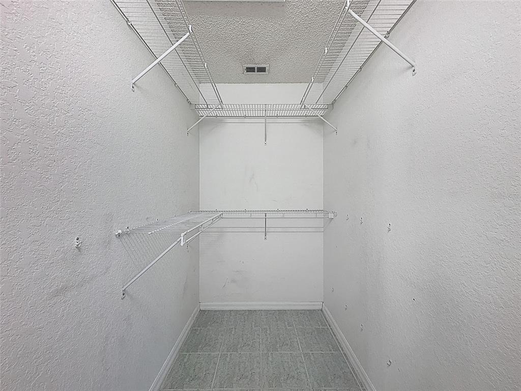 9545 Montebello Lane Spring Hill, FL 34608 - Photo 29 of 74 a view of walk in closet