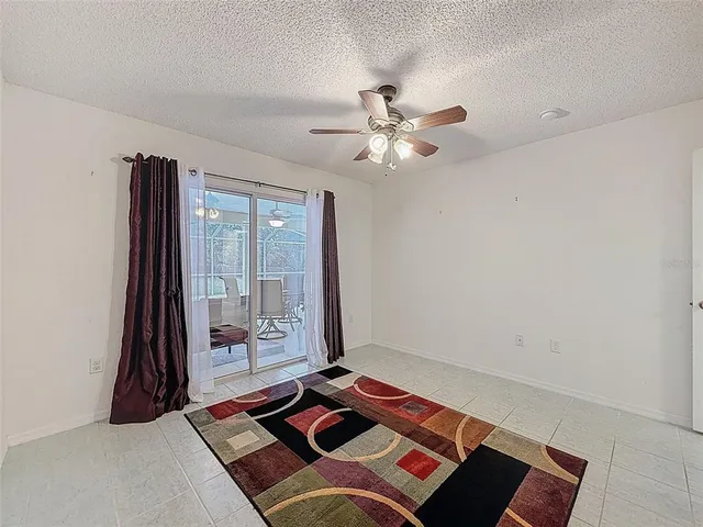 a view of a house with backyard sitting area and porch