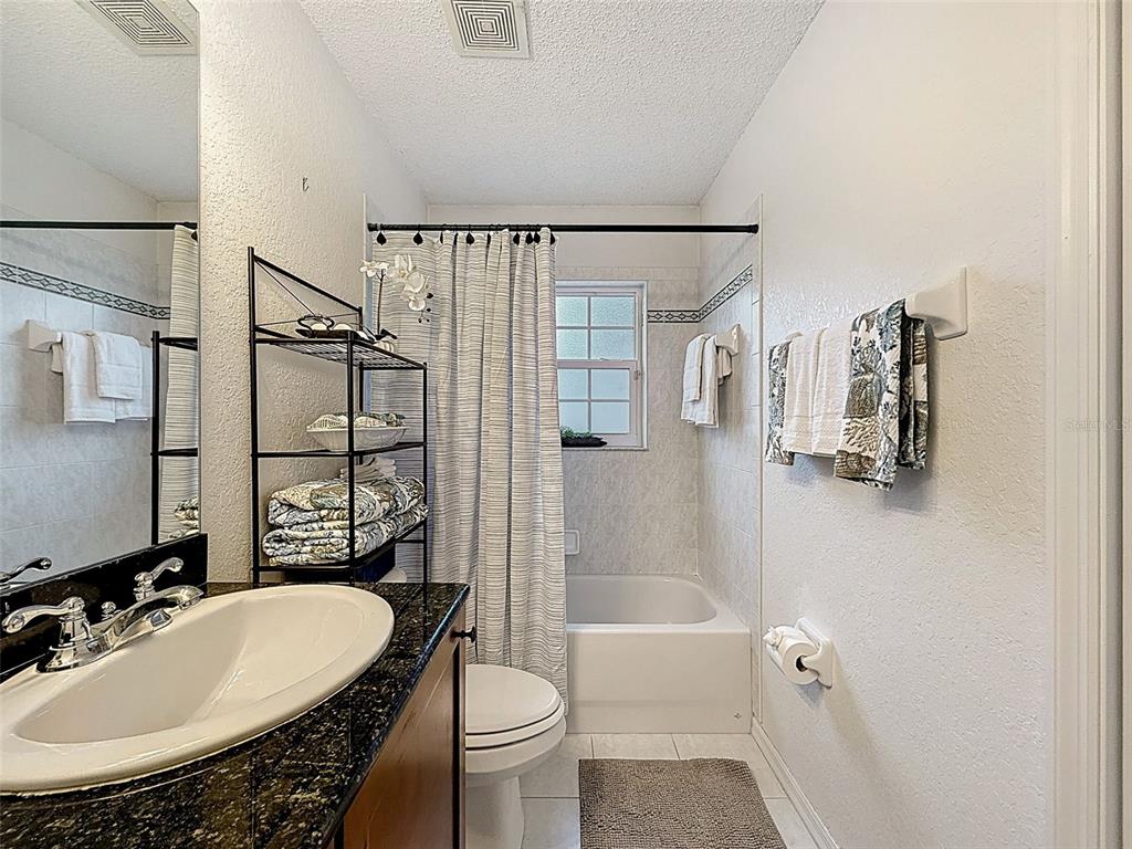 9545 Montebello Lane Spring Hill, FL 34608 - Photo 41 of 74 a bathroom with a sink toilet and shower