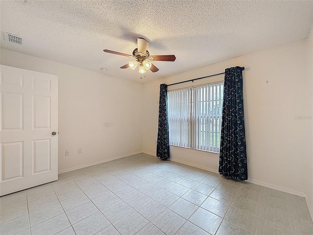 9545 Montebello Lane Spring Hill, FL 34608 - Photo 46 of 74 a view of an empty room with a window