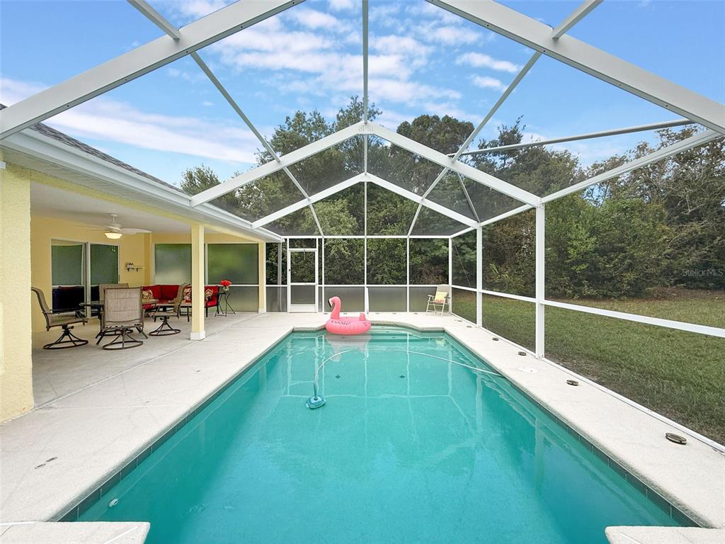 9545 Montebello Lane Spring Hill, FL 34608 - Photo 55 of 74 a house view with a sitting space and garden view