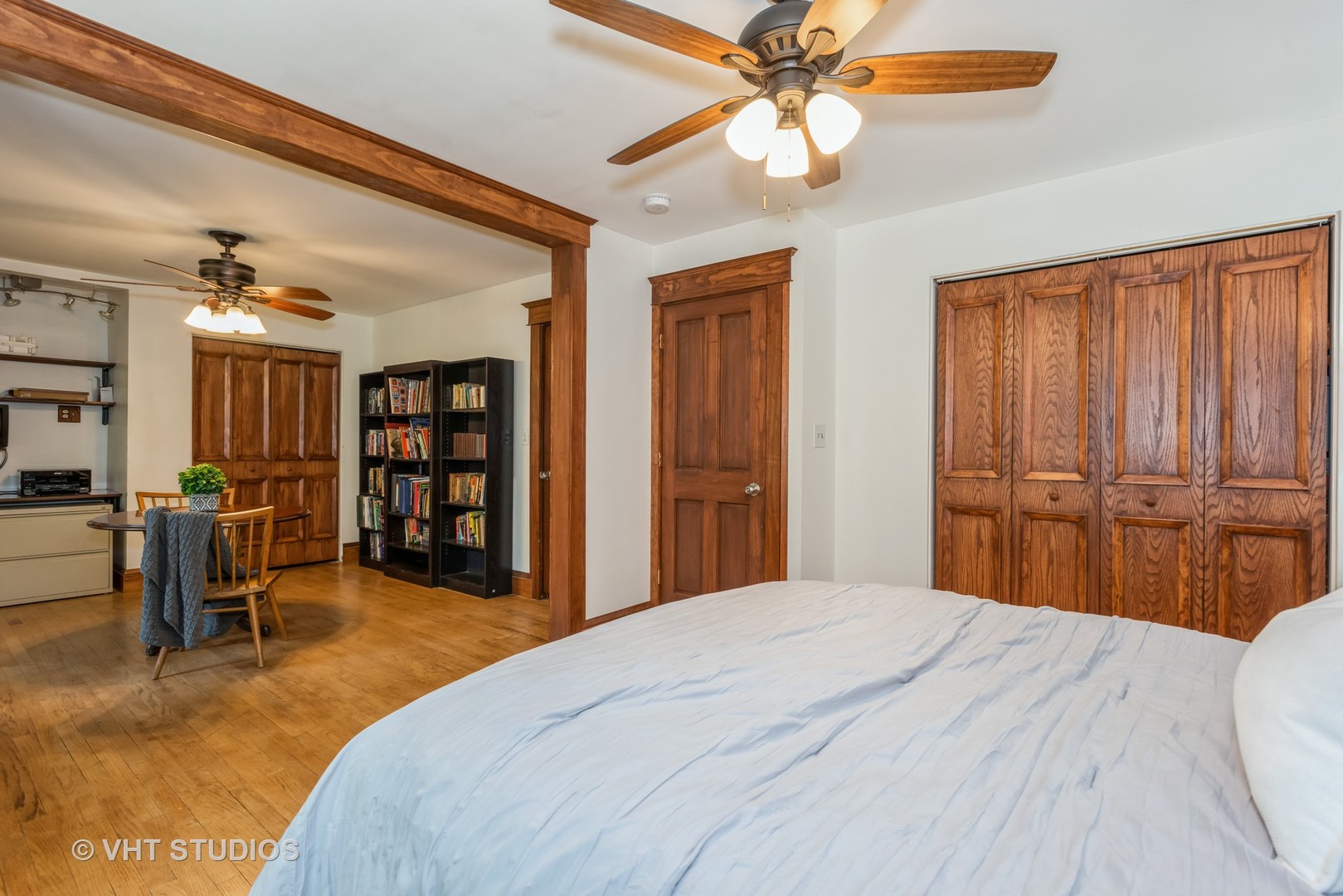 708 Riedy Road Lisle, IL 60532 - Photo 14 of 25 a bedroom with a bed and a chandelier