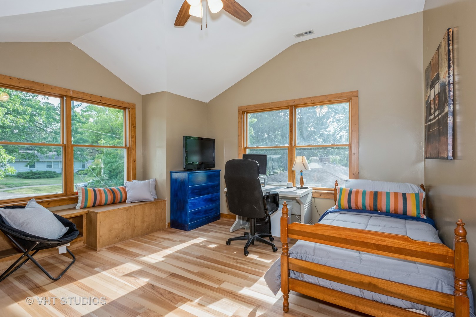 708 Riedy Road Lisle, IL 60532 - Photo 15 of 25 a living room with furniture a flat screen tv and a floor to ceiling window