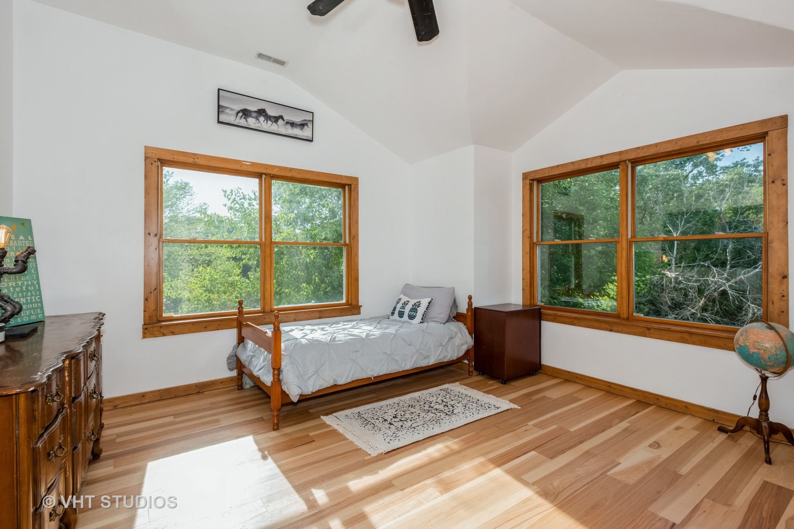 708 Riedy Road Lisle, IL 60532 - Photo 16 of 25 a bedroom with a bed a window with outer view and wooden floor