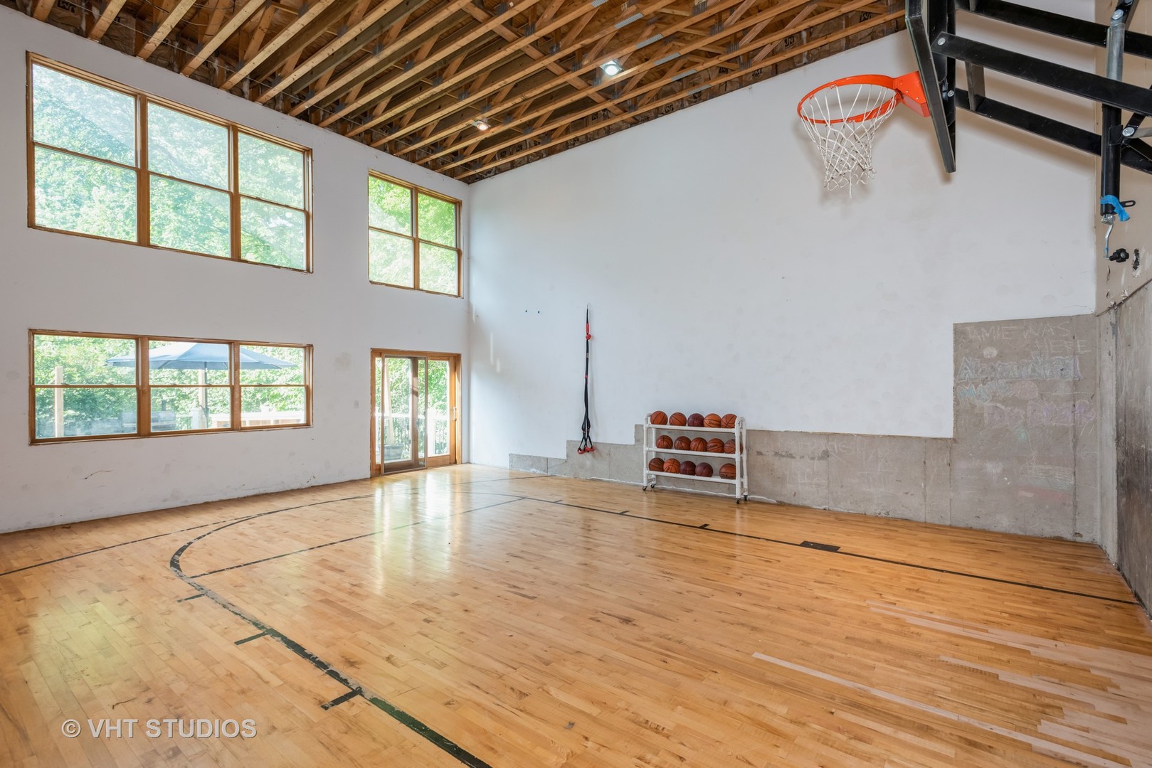 708 Riedy Road Lisle, IL 60532 - Photo 21 of 25 a view of an empty room with window and wooden floor