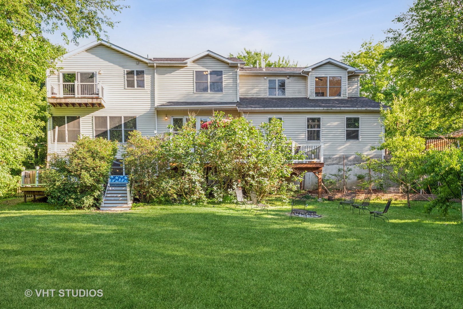 708 Riedy Road Lisle, IL 60532 - Photo 3 of 25 a front view of a house with a yard and trees
