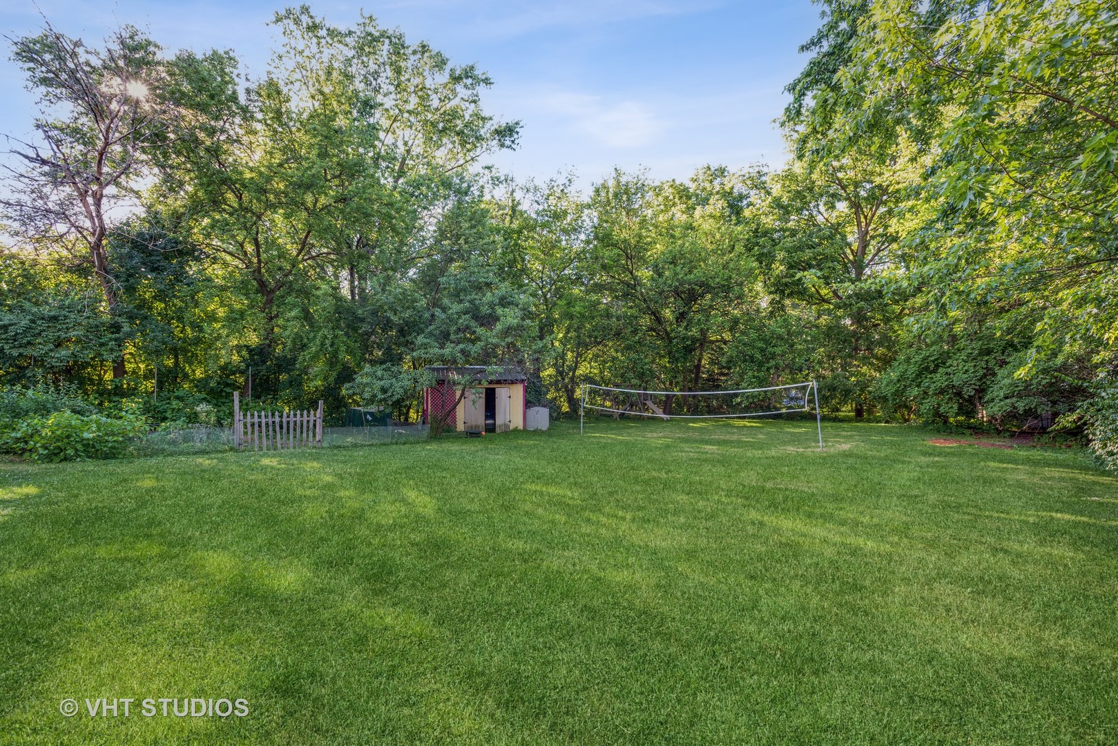708 Riedy Road Lisle, IL 60532 - Photo 5 of 25 a view of a wooden deck and a yard