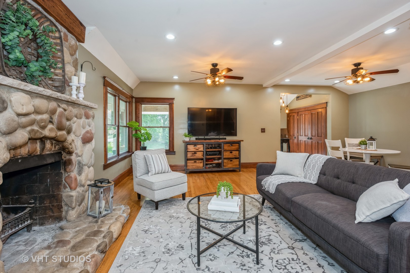 708 Riedy Road Lisle, IL 60532 - Photo 7 of 25 a living room with furniture a flat screen tv and a fireplace