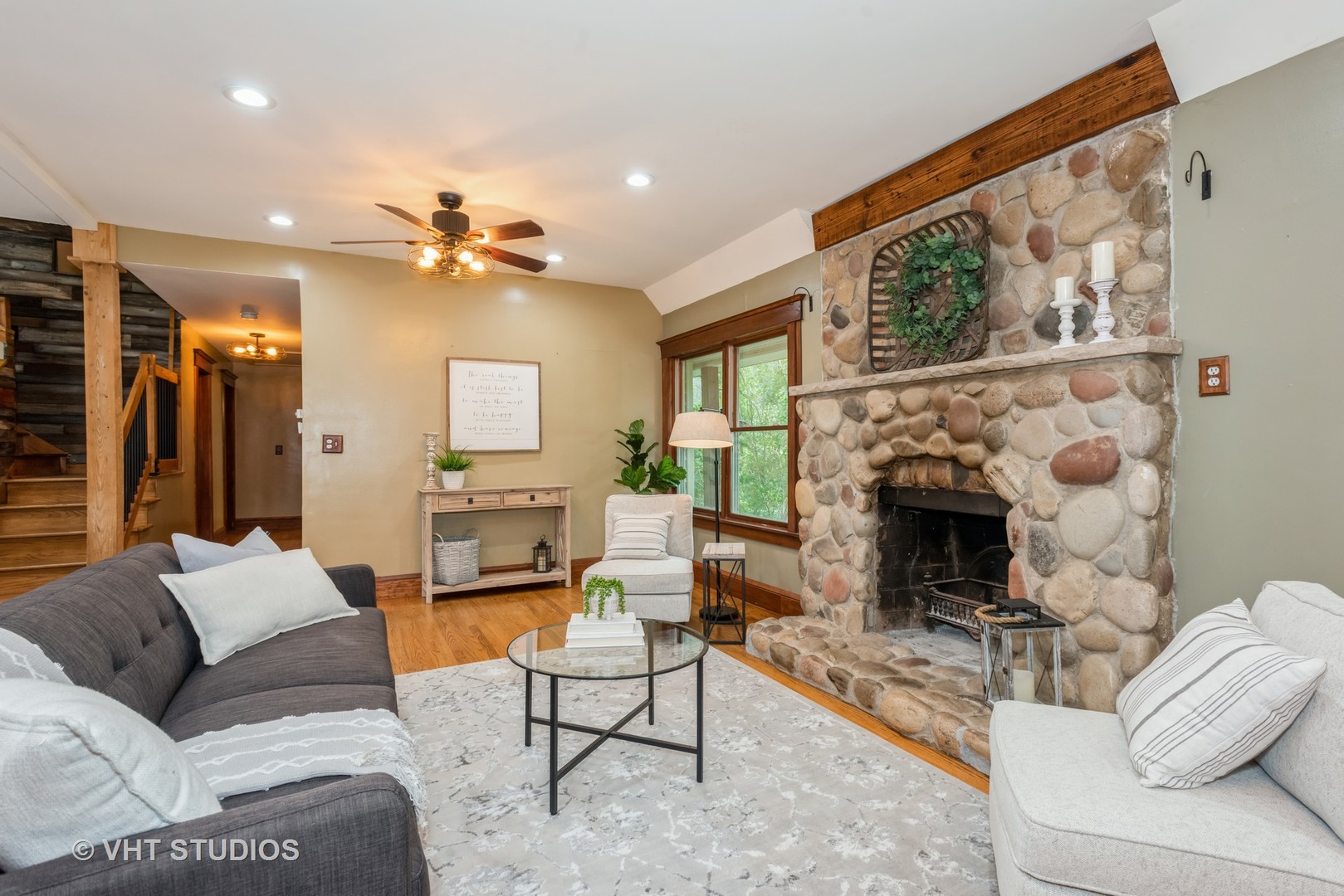 708 Riedy Road Lisle, IL 60532 - Photo 8 of 25 a living room with furniture a fireplace and a flat screen tv