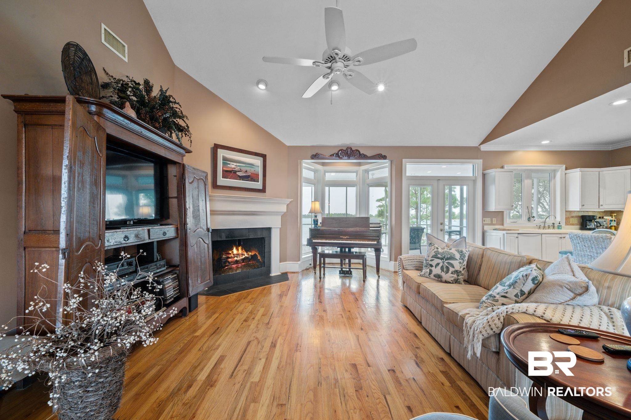 31800 River Road Orange Beach, AL 36561 - Photo 18 of 69 Living room with ceiling fan, high vaulted ceiling, light hardwood / wood-style floors, and french doors