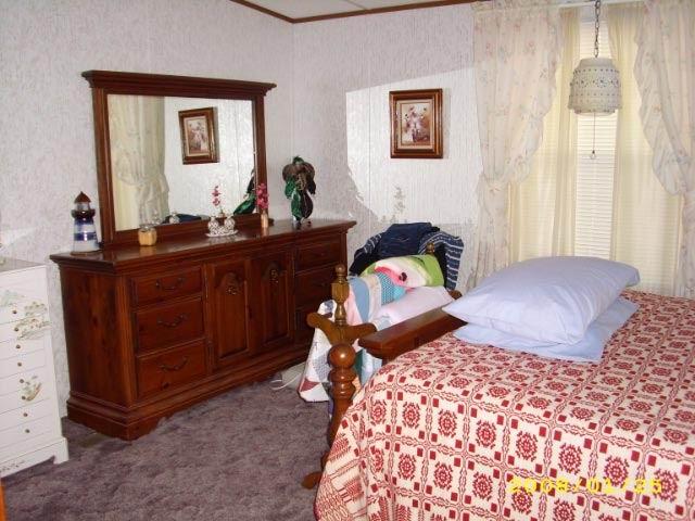 383 Clemons Road Roanoke, VA 24019 - Photo 8 of 11 a bedroom with a bed and a dresser