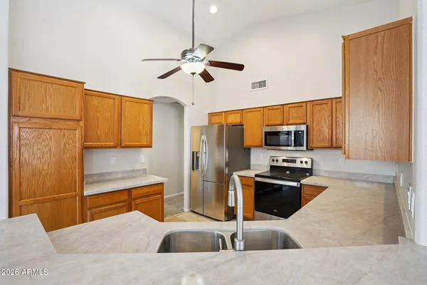 a view of a livingroom with a fireplace and cabinet