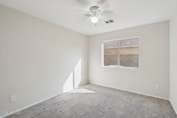 a view of hallway with stainless steel appliances granite countertop furniture and a refrigerator