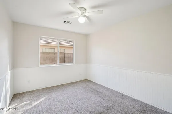 an empty room with a bathroom