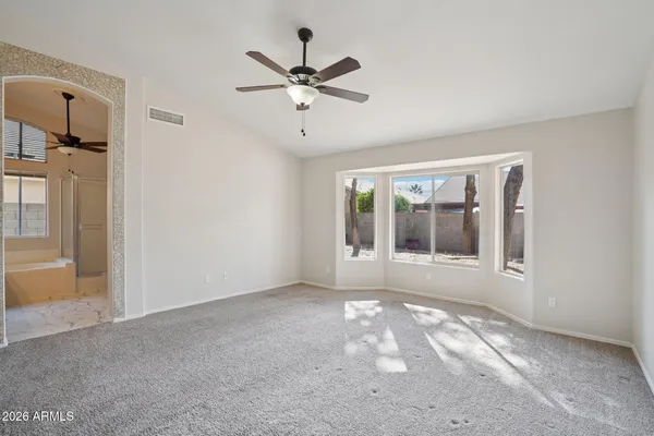 a view of an empty room with a window