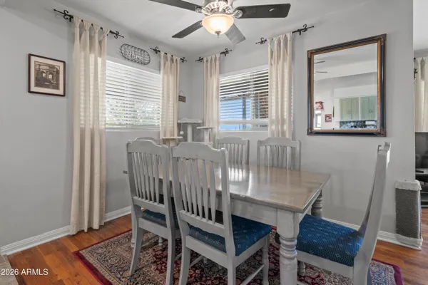 a view of a livingroom with furniture and a ceiling fan