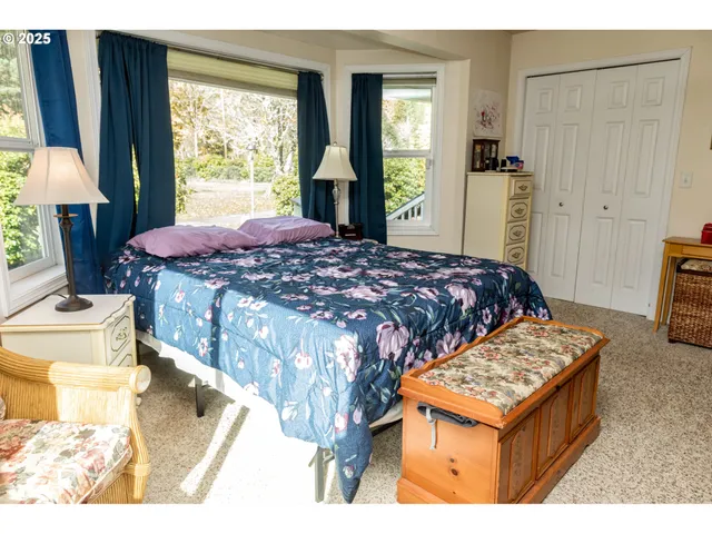 a living room with furniture and a closet