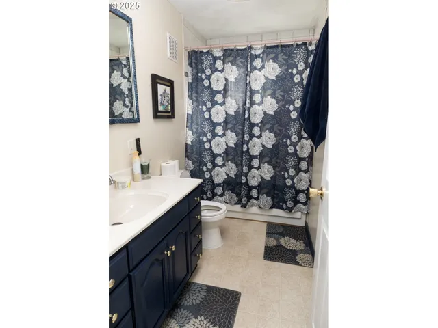 a view of a house with a porch and furniture