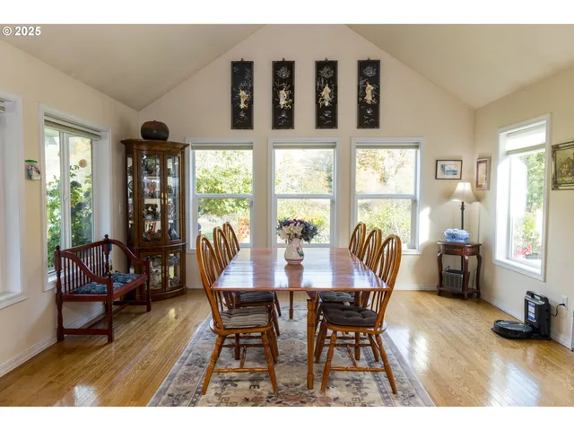 a view of a dining room with furniture and windows