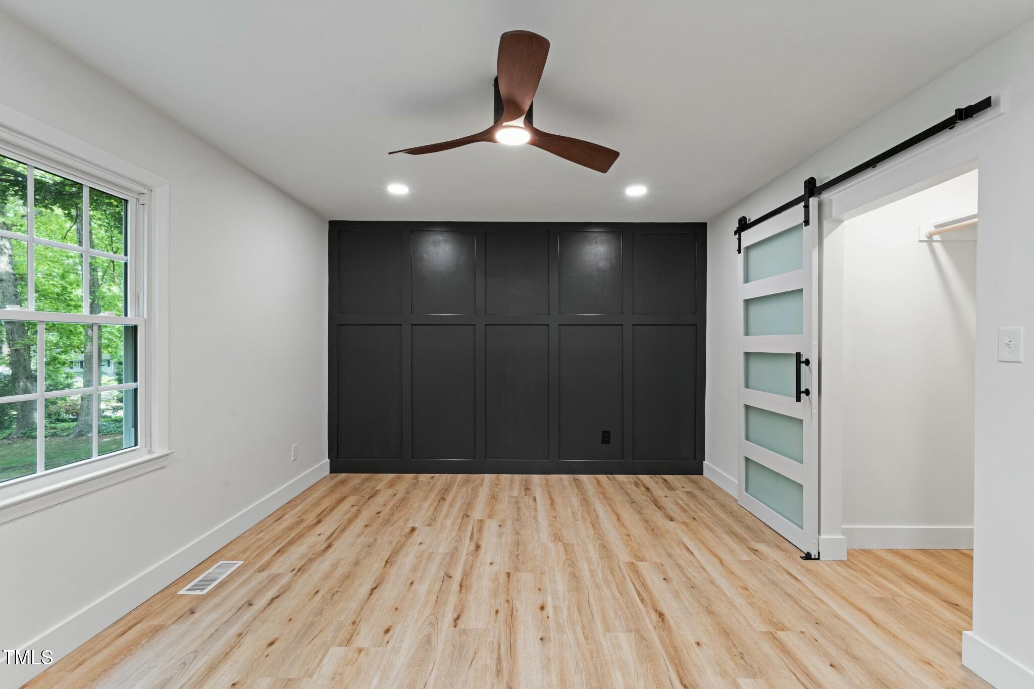 6421 Arrington Road Raleigh, NC 27607 - Photo 11 of 31 a view of a room with wooden floor and window