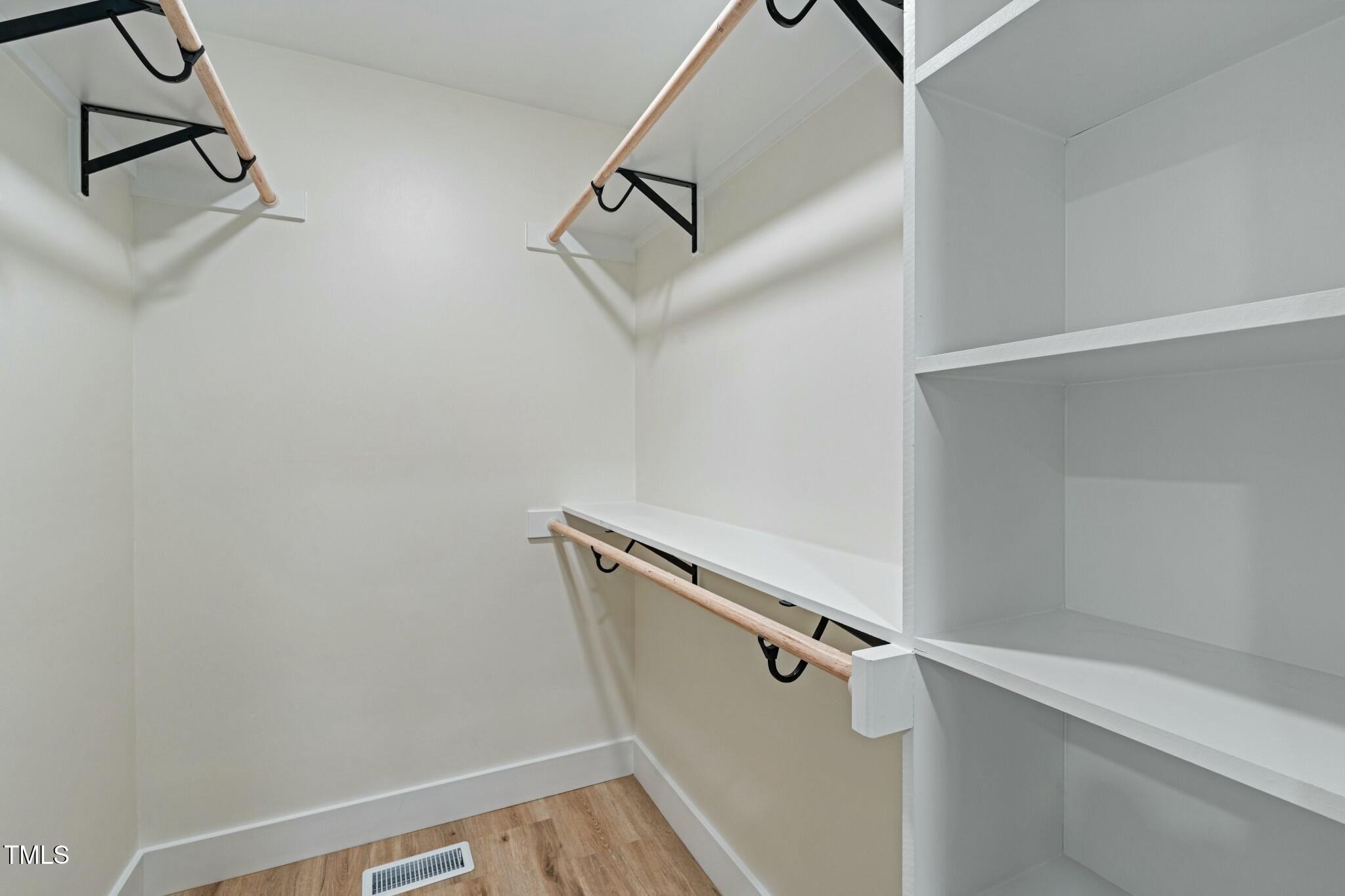 6421 Arrington Road Raleigh, NC 27607 - Photo 14 of 31 a view of a room with rack on the wall