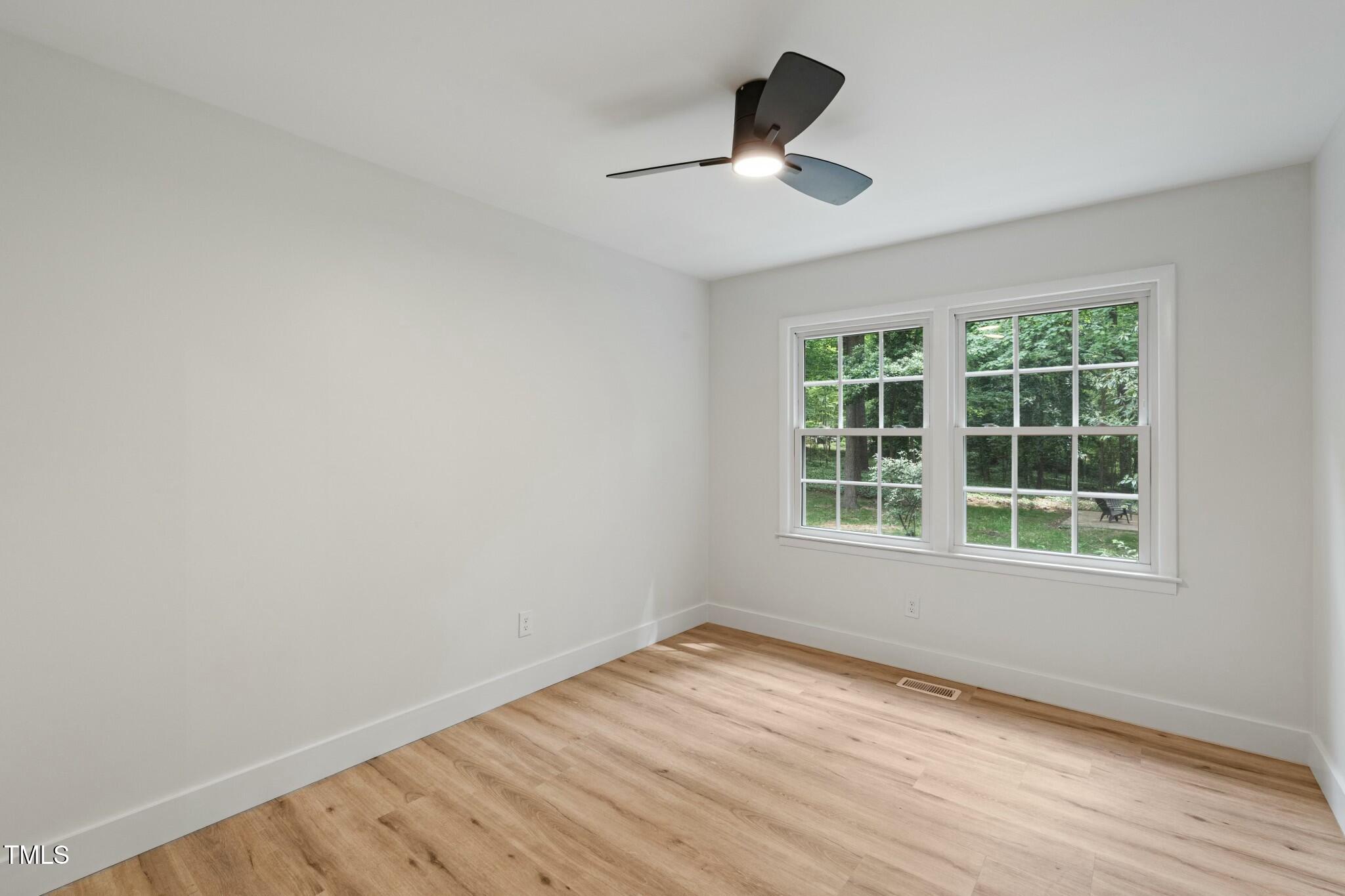 6421 Arrington Road Raleigh, NC 27607 - Photo 15 of 31 an empty room with a window