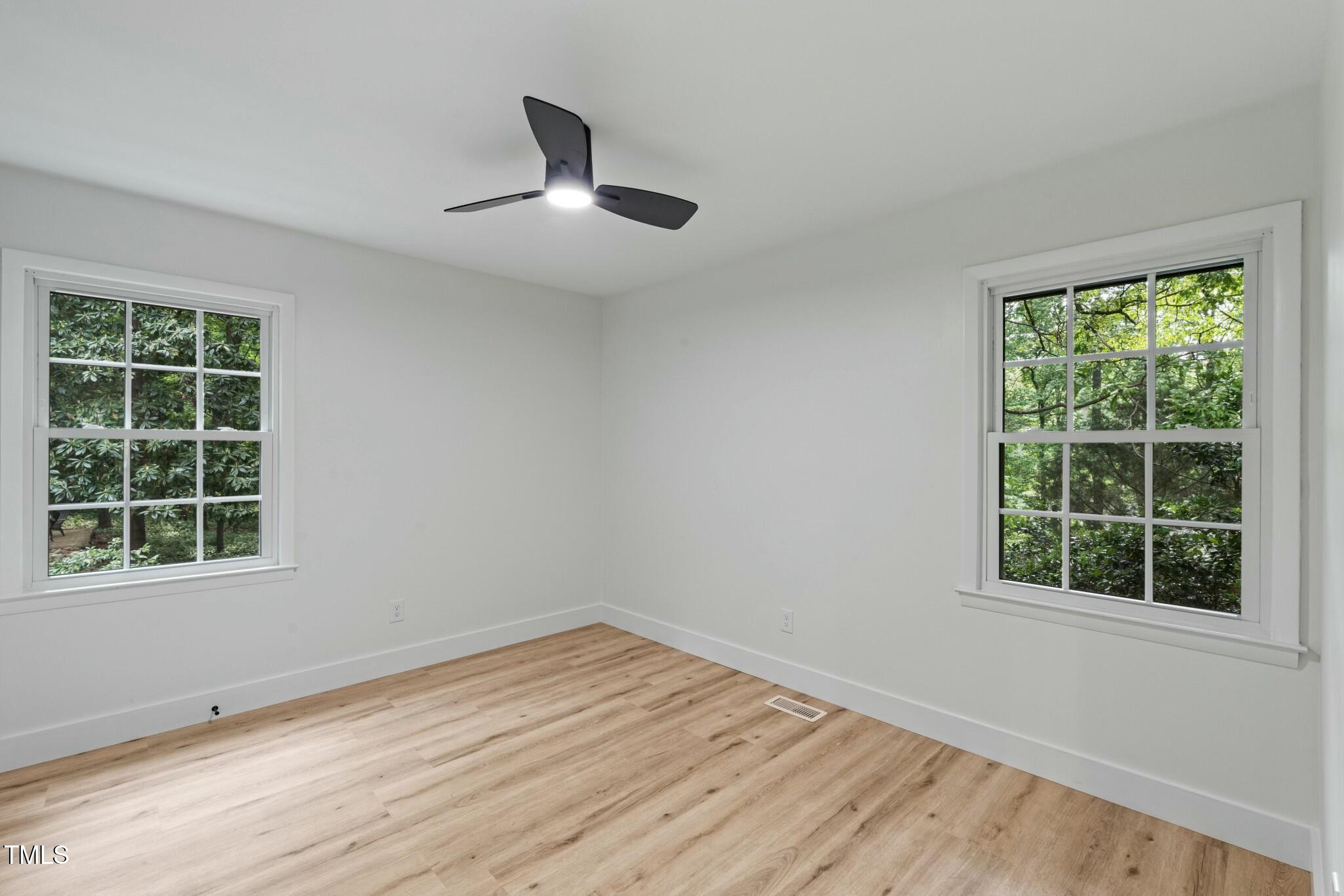 6421 Arrington Road Raleigh, NC 27607 - Photo 16 of 31 an empty room with a window
